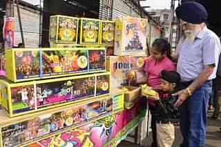 Children buy firecrackers during Diwali in Amritsar. (Sameer Sehgal/Hindustan Times via GettyImages) 