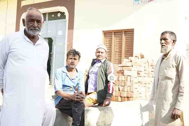 Residents of Syed Mohalla. The person on the extreme right is Faqir. The person on extreme left is Tahir’s neighbour. 