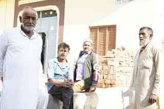Residents of Syed Mohalla. The person on the extreme right is Faqir. The person on extreme left is Tahir’s neighbour. 
