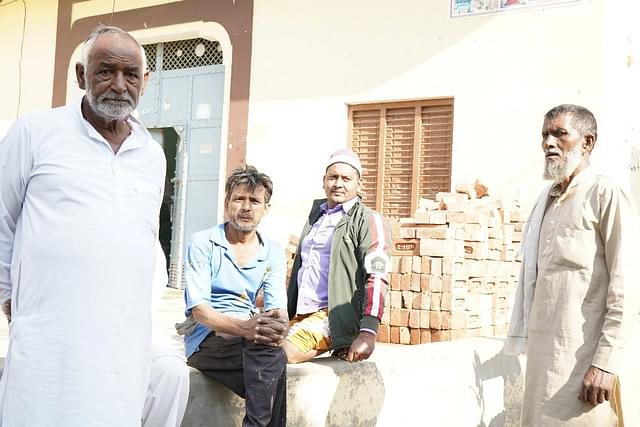 Residents of Syed Mohalla. The person on the extreme right is Faqir. The person on extreme left is Tahir’s neighbour. 