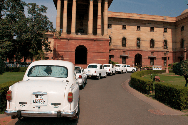 Official Hindustan Ambassador cars waiting in line outside North Block, Secretariat Building, New Delhi. (Photo: Christian Haugen/Wikimedia Commons)
