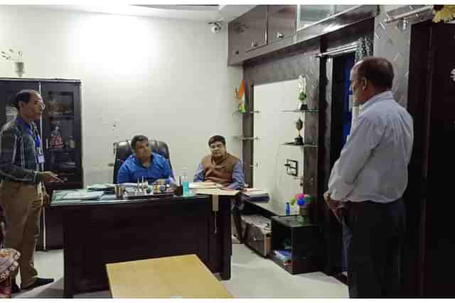 NCPCR chairman Priyank Kanoongo (seated on the chair in the centre) and Haseen Parvez (seen standing in a white shirt)