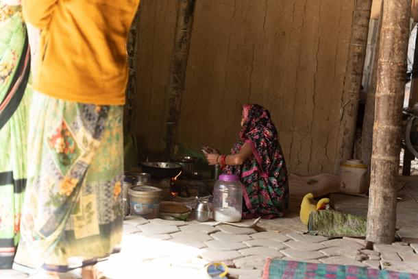 A resident cooking on clay stove