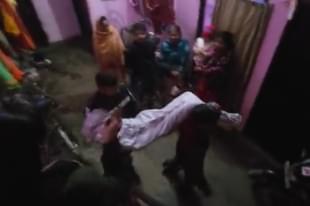 Police taking away body of the victim