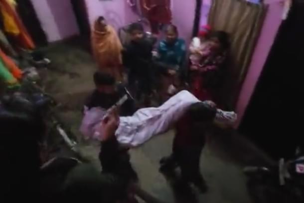 Police taking away body of the victim