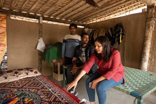 This correspondent with the cam residents checking out their embroidered work