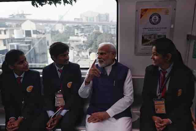 PM Modi interacting with students while traveling on Nagpur Metro (@narendramodi/Twitter)