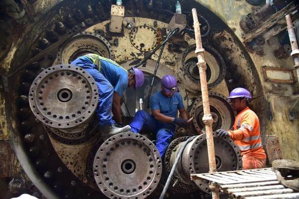 Workers attending to a TBM (MMRC)