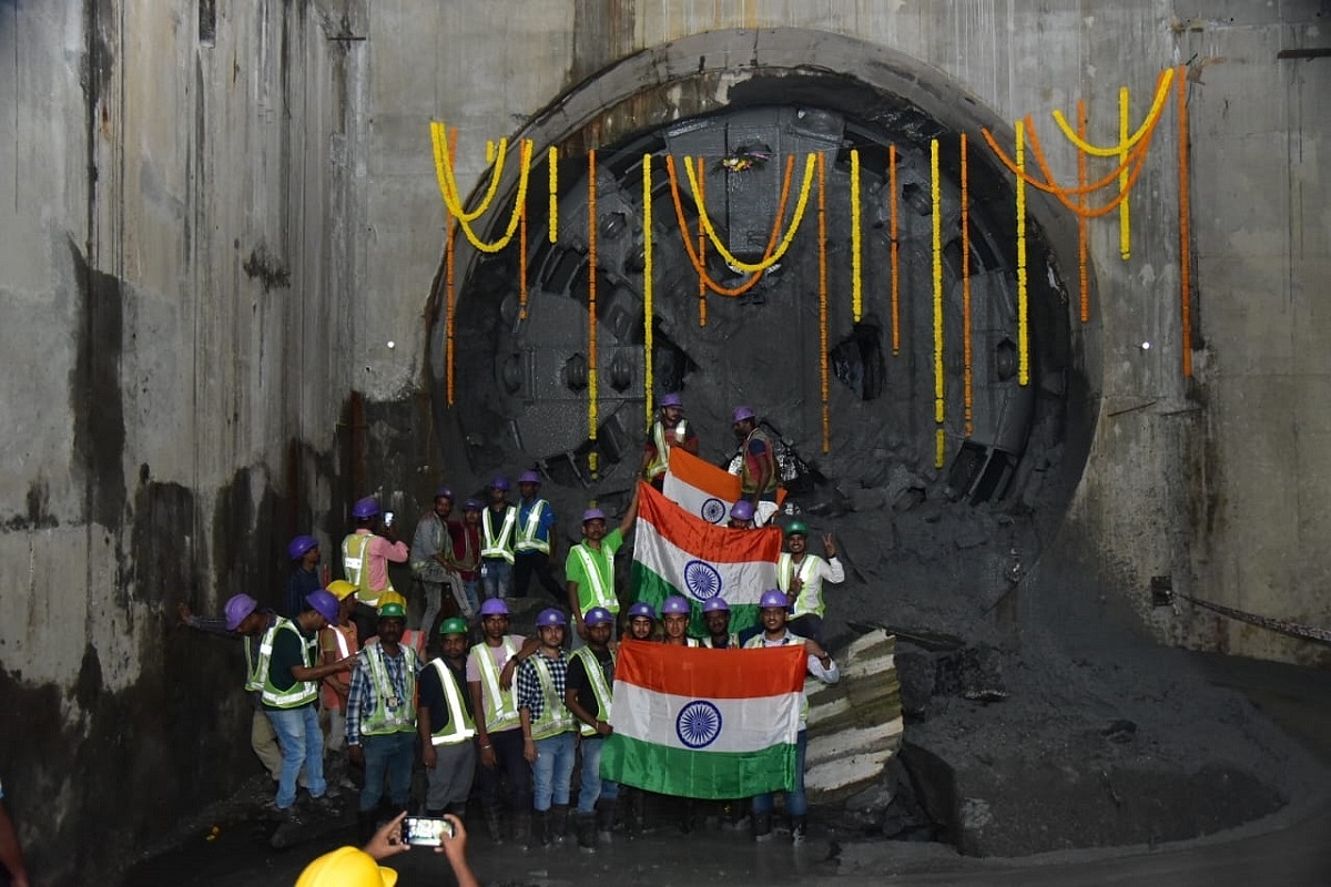 Workers with Indian flags after the final breakthrough (MMRC) 