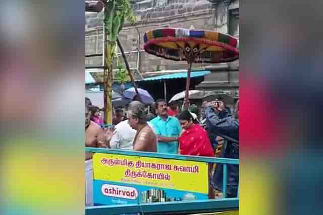 CM Stalin's wife shielded by deity's umbrella (A screenshot from the video)