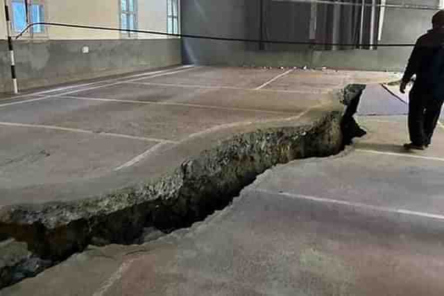 A deep fissure developed in middle of a badminton court in Joshimath with gradual sinking of the town. (Twitter) 