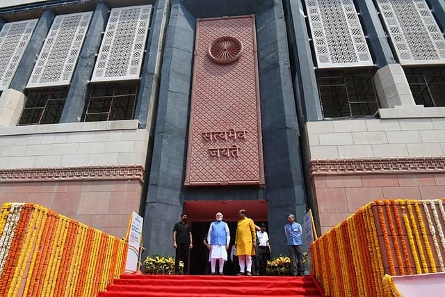 PM Modi at the entrance of the new parliament building (PIB)