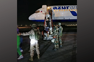 Passengers escorted out of an at-risk Azur Air 4501 flight by Indian Air Force personnel (Photo: Indian Air Force/Twitter)