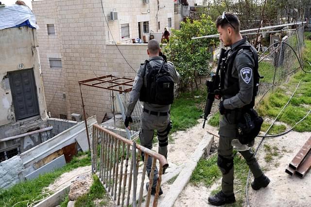Israeli border police officers at the family home of Palestinian gunman Khaire Alkam in A-Tur, East Jerusalem.
(Twitter/@FRANCE24)