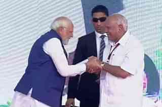 PM Modi with former Karnataka chief minister B S Yediyurappa (Pic Via Twitter)