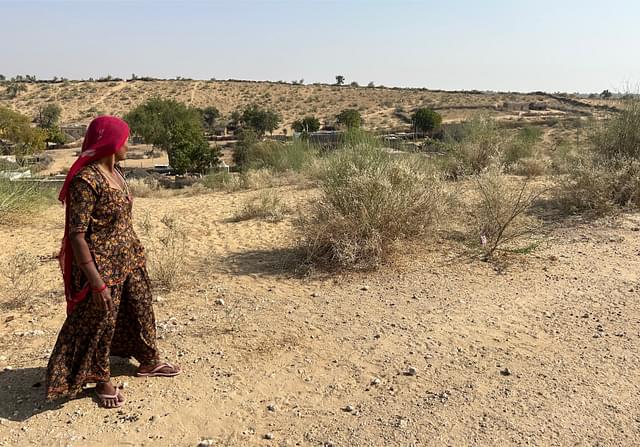Gemra's mother Amku shows the Pakistan border from a point near her house