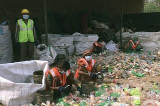 Representative image of workers sorting plastic waste. (Pic via Twitter)