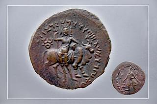 Coin of Vima Kadphises (reign 113-127 CE) : Showing Siva with three faces, Trishul, Nandi and the declaration 'Sarvalokeshwara'.
