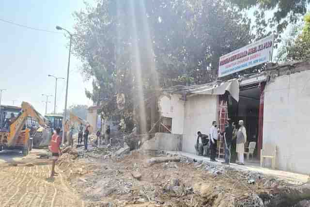 Boundary walls and ceilings of a temple and a mosque situated at ITO demolished for pedestrian area. (Twitter).