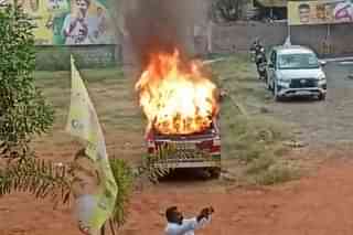 Vehicle torched by YSRCP activists at Gannavaram TDP office (@shinenewshyd/Twitter)