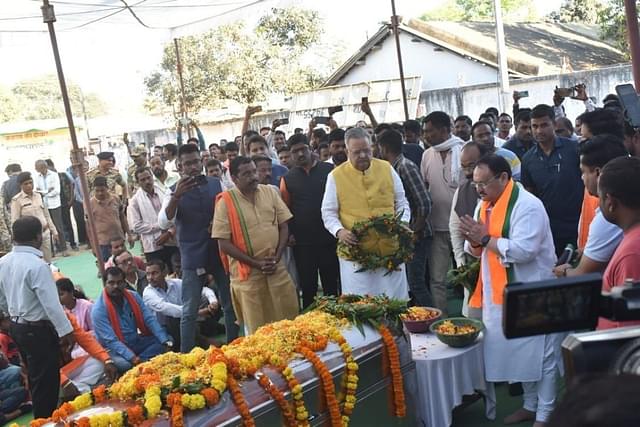 BJP President J.P. Nadda and former Chhattisgarh CM, Raman Singh, offer prayers during the cremation ceremony of BJP worker Sagar Sahu (Source: @JPNadda)