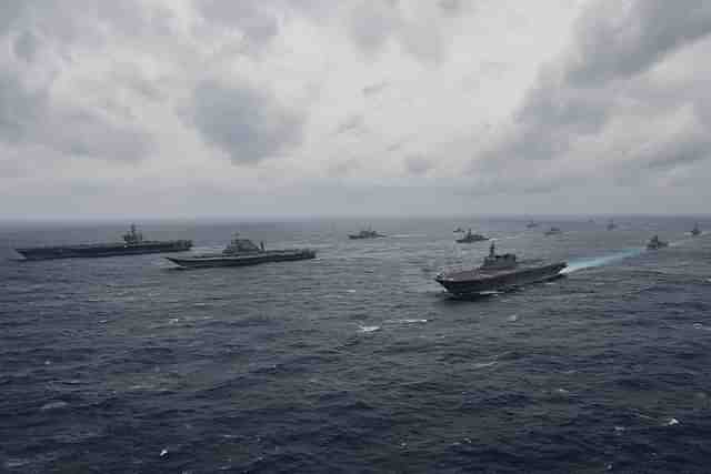 Carriers from the Indian Navy, Japan’s Maritime Self-Defense Force and the US Navy sail in formation during exercise Malabar 2017. (US Navy/Twitter)