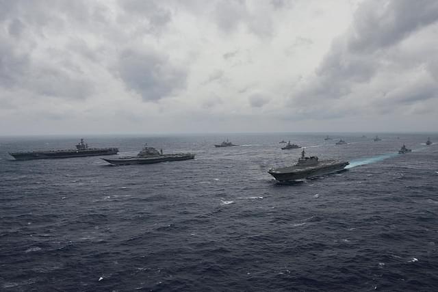Carriers from the Indian Navy, Japan’s Maritime Self-Defense Force and the US Navy sail in formation during exercise Malabar 2017. (US Navy/Twitter)