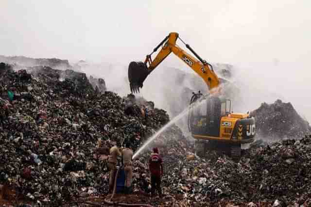 Firefighters still at work in the Brahmapuram waste dump yard near Kochi on 6 March, five days after the fire started. 
(Photo: Kerala Govt PR Dept).