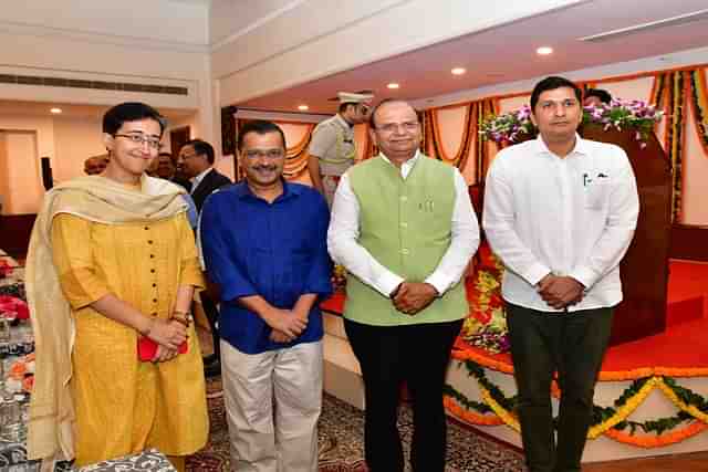 Newly stated ministers, Atish and Saurabha Bhardwaj, along with CM Arvind Kejriwal, Delhi LG V.K. Saxena (Source: @LtGovDelhi)