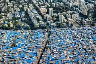 A series of renewal projects are underway in Mumbai, including the Bhendi Bazaar and Dharavi Redevelopment Project. (Johnny Miller Photographs).
