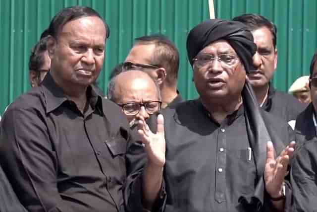 T R Baalu of DMK (L) and Congress president Mallikarjun Kharge 