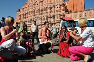 Foreign tourists with few locals at Hawa Mahal in Jaipur,Rajasthan