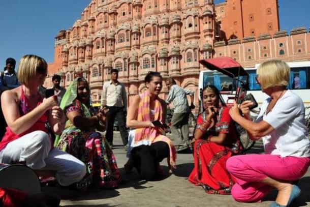 Foreign tourists with few locals at Hawa Mahal in Jaipur,Rajasthan