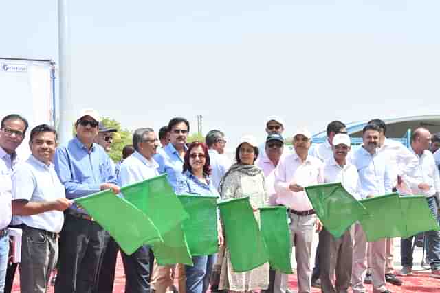 Freight train carrying containers being flagged off at New Rewari Station