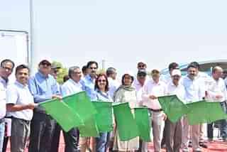 Freight train carrying containers being flagged off at New Rewari Station