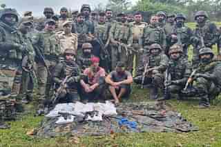 Indian Army Soldiers and J&K Police with two terrorist and warlike stores (Via @sneheshphilip)