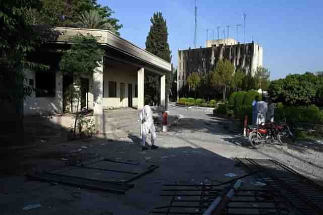 Radio Pakistan's building burnt by protestors in Pakistan's Peshawar (Via AFP)