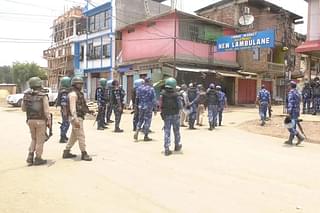 Security forces in New Lambulane where trouble erupted Monday (Credit: EastMojo)