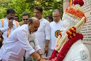 Outgoing Karnataka chief minister, Basavaraj Bommai paying obeisance to Basaveshwara 