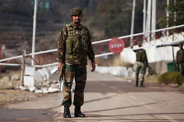 Indian army soldiers stand guard at the Chakan-da-Bagh outpost on the India- Pakistan border near Poonch (Photo credits- AFP/Getty Images)
