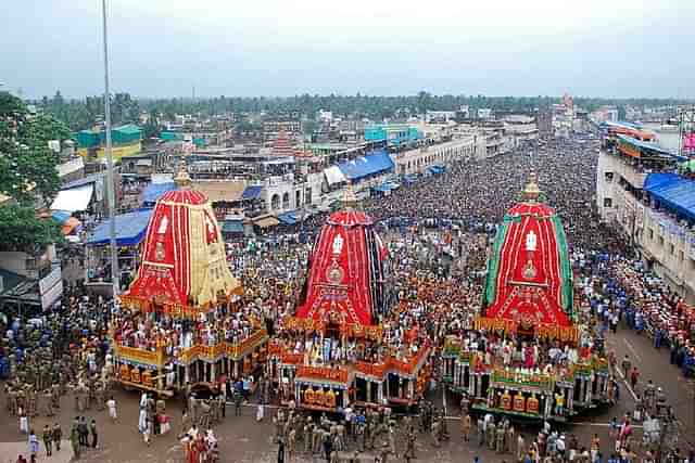 Devotees gather as
three giant chariots are pulled during the Rath Yatra of Lord Jagannath in Puri.
(Photo credit should read STR/AFP/GettyImages)