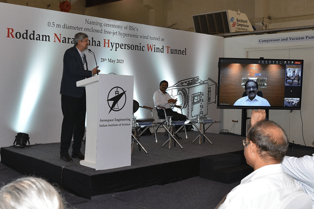 DRDO Chairman Dr Samir V Kamat addressing the gathering, with ISRO Chairman S Somanath present in virtual mode (Photo: IISc)