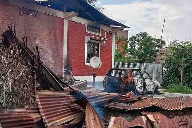 A Meitei house set on fire by Kuki militants in Imphal East