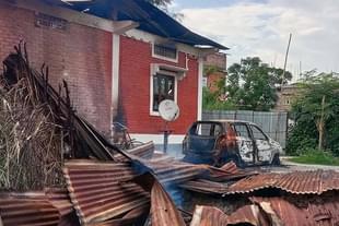 A Meitei house set on fire by Kuki militants in Imphal East