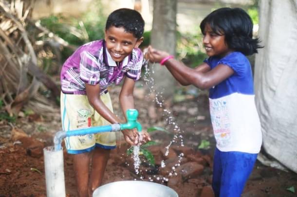 Bore well dug as part of a WaterAid project in Maharashtra brings safe drinking water to these children. Photo Credit: WaterAid