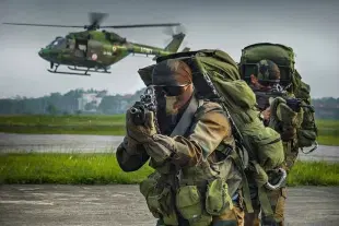 Indian Special Forces commandos with an Army Aviation helicopter visible in the background (representative image).
