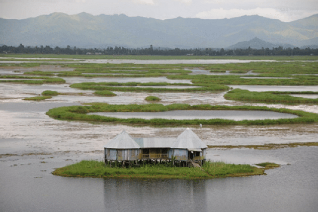 A house sitting atop floating clusters of vegetation called phumdis over the picturesque Loktak lake, Bishnupur district.
