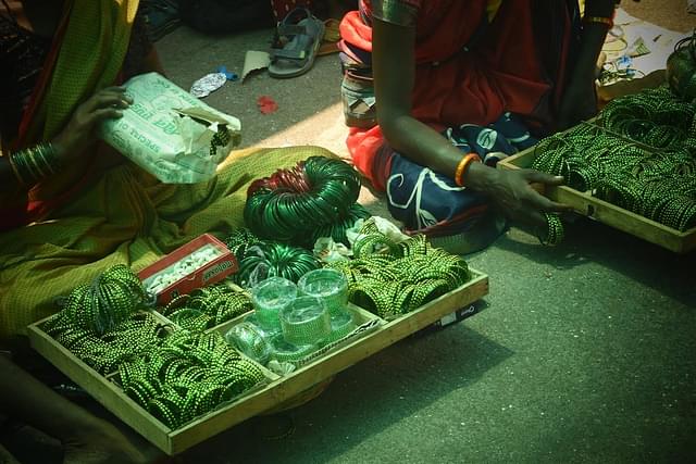Green bangles sold at the temple premises that are offered to the deity