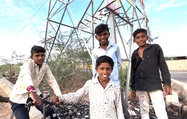 In the middle, the boy in blue shirt is Ganesh and the one in printed shirt below him is Sat Ram