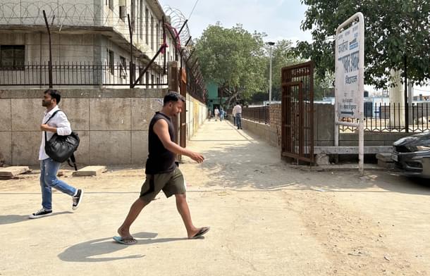 The entrance of the lane in which the murder took place, showing the board of AAP MLA Jai Bhagwan